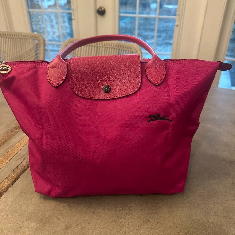 Longchamp Le Pliage Club Top Handle Bag in fuchsia.